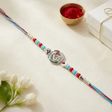 92.5 Silver Om & Peacock Feather Rakhi